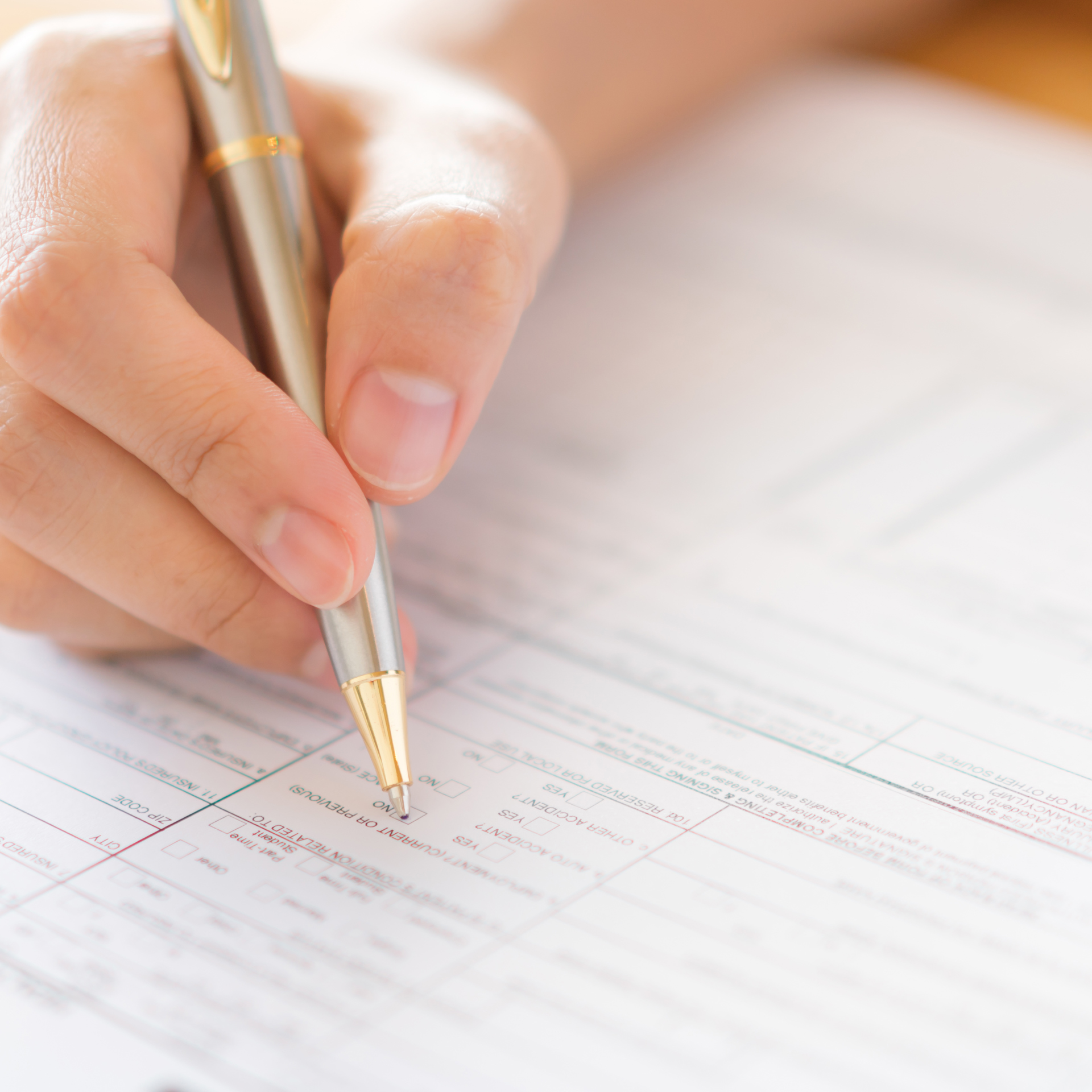 21236176 Hand With Pen Over Application Form