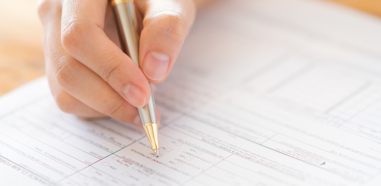 21236176 Hand With Pen Over Application Form