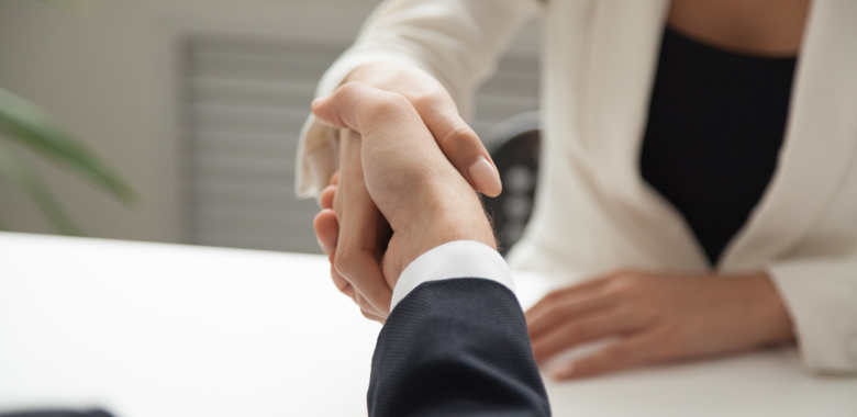 Mp25836461 Female Worker Greeting Business Partner With Handshake