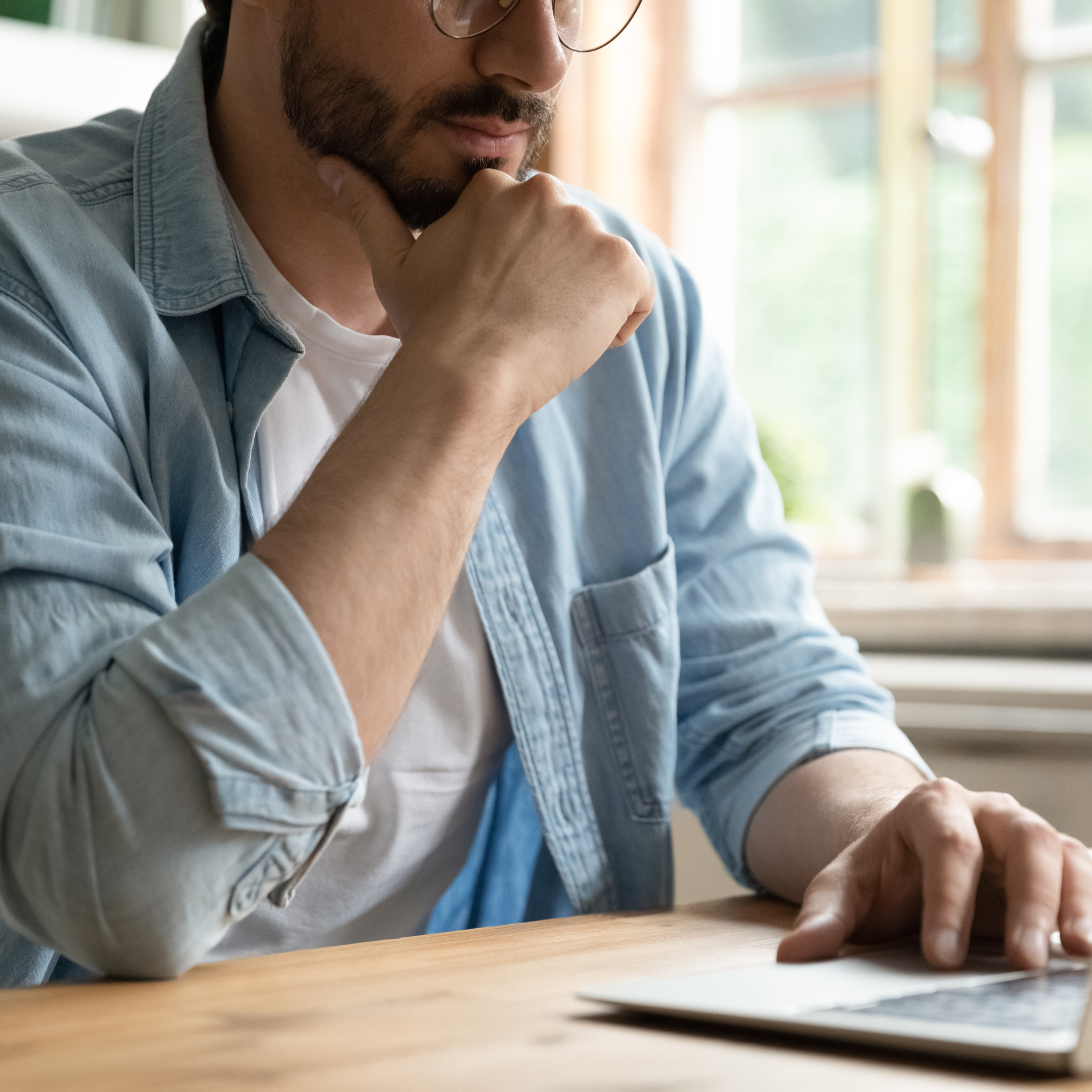 48597869 Cropped Image Thoughtful Young Man Working On Computer (1)