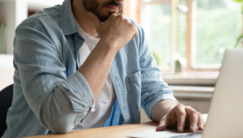 48597869 Cropped Image Thoughtful Young Man Working On Computer (1)