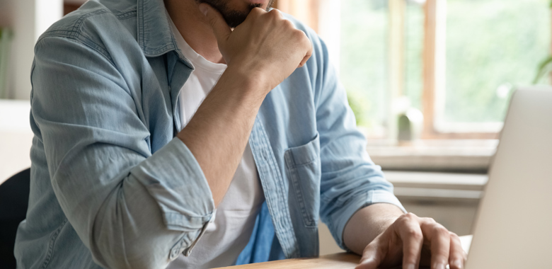 48597869 Cropped Image Thoughtful Young Man Working On Computer (1)