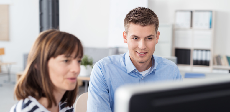 13077060 Business People Reading Something On Computer