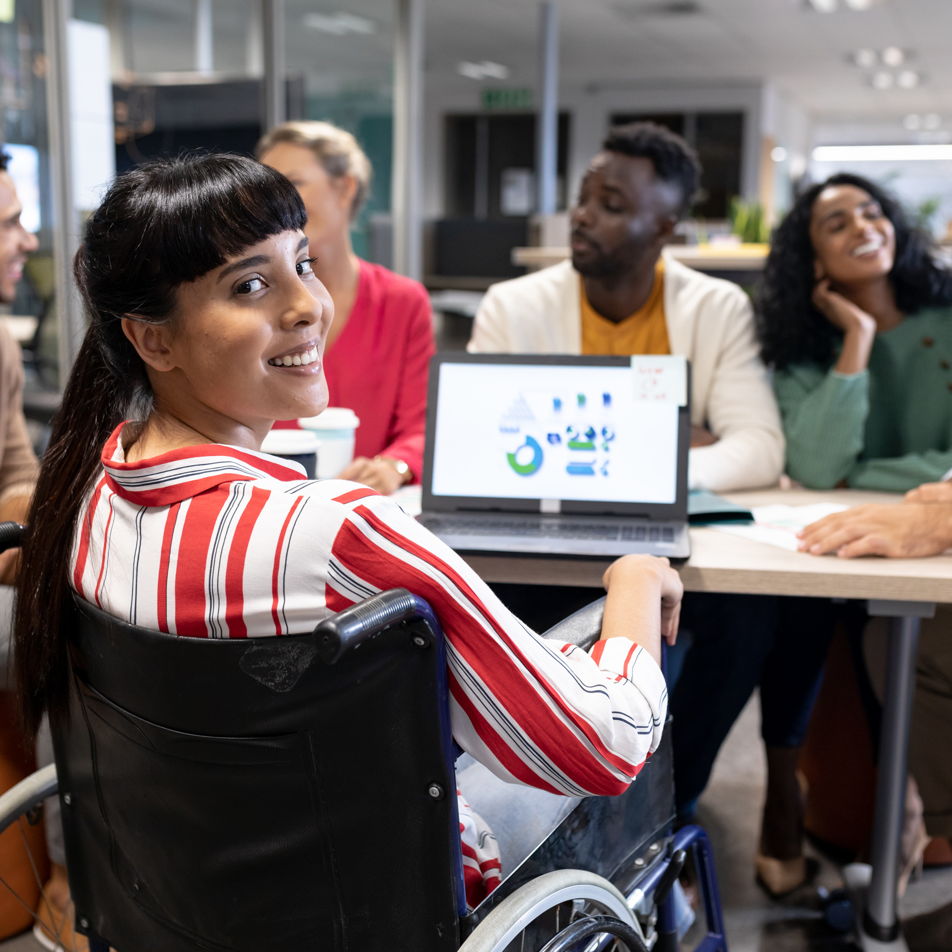 55506434 Smiling Biracial Disabled Businesswoman Looking Over