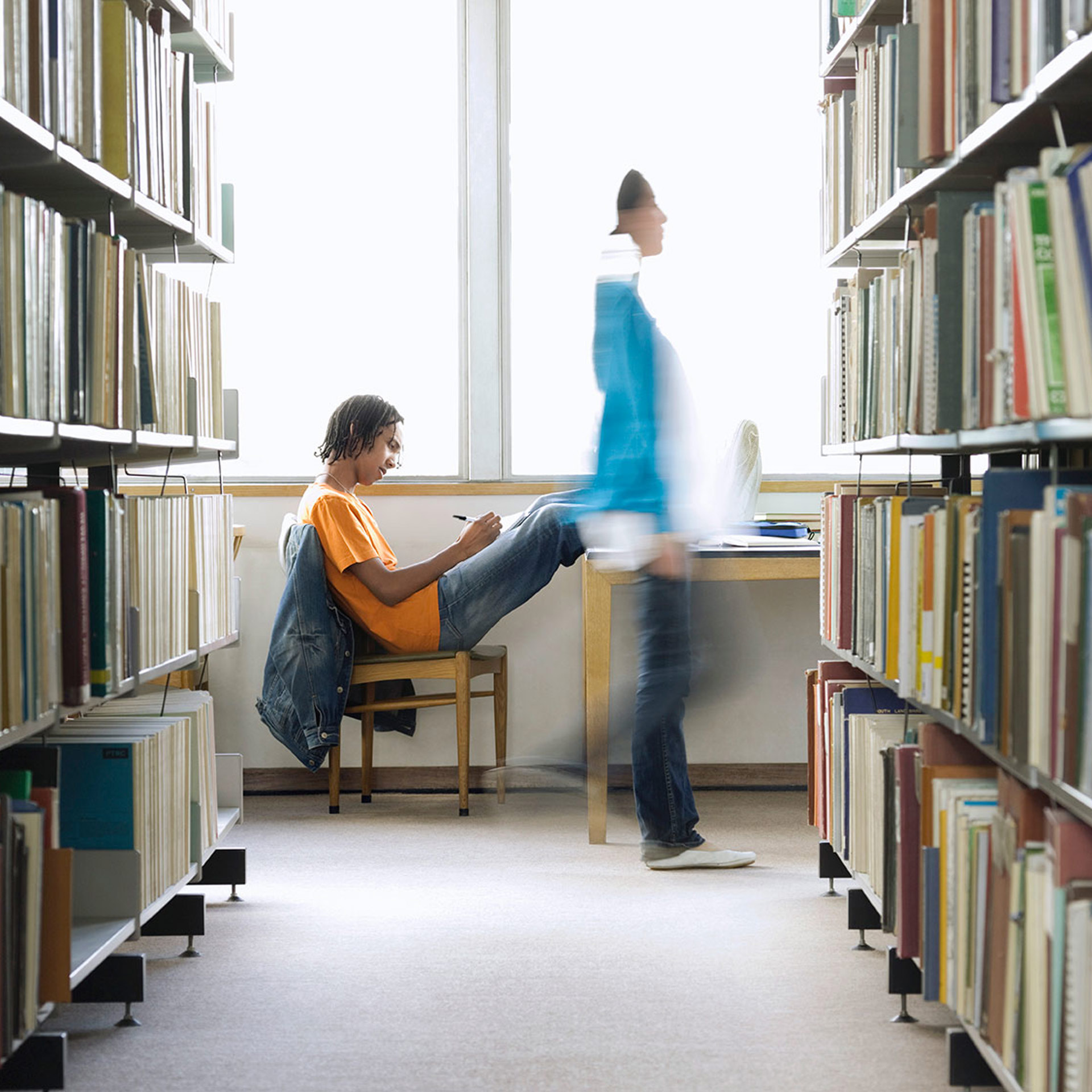 18805084 College Student Doing Homework In Library