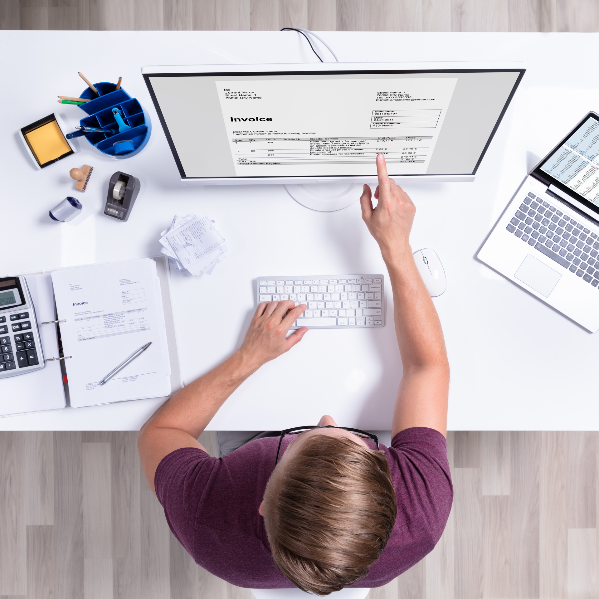 32616673 Businessman Checking Invoice On Laptop